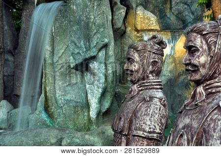 Chinese Dragons, Statues Of Ronin And Fountains At Sunset