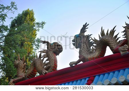 Chinese Dragons, Statues Of Ronin And Fountains At Sunset