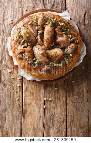 Palestinian Musakhan Or Sumac Chicken Closeup On The Table. Vertical Top View
