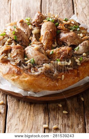Chicken With Sumac And Onions With Flat Bread Taboo Close-up On A Plate. Vertical