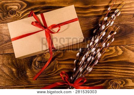 Pussywillow Bouquet And Cardboard Gift Box On Rustic Wooden Table. Top View