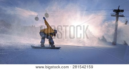 Freerider Snowboarder Girl Slides From The Mountain In Backlight Sun.