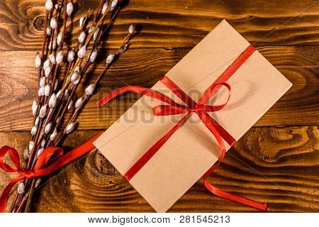 Pussywillow Bouquet And Cardboard Gift Box On Rustic Wooden Table. Top View