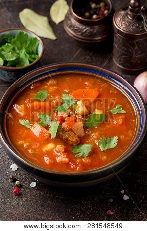 Thick Tomato Soup With Meat, Cereals And Vegetables. Traditional Oriental Cuisine, Spicy Stew With B