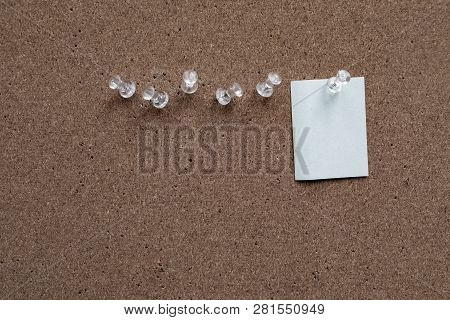 Horizontal Cork Board With Many, Sticky Notes Pinned