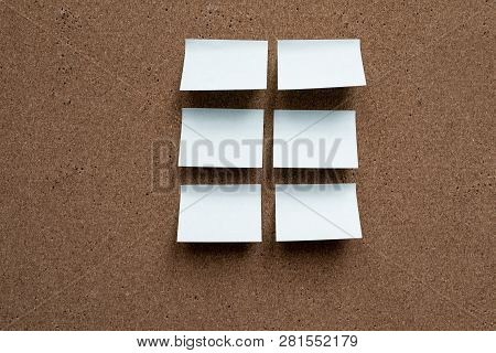 Horizontal Cork Board With Many, Sticky Notes Pinned