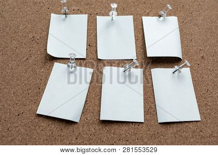 Horizontal Cork Board With Many, Sticky Notes Pinned