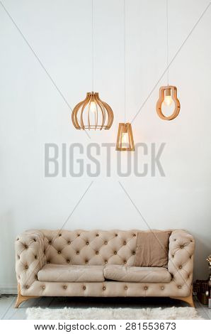 Modern Living Room Interior With Beige Sofa  And Pendant Wooden  Light Lamps