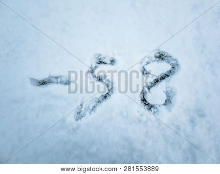 Temperature Of -58 Written In The Freshly Fallen Snow