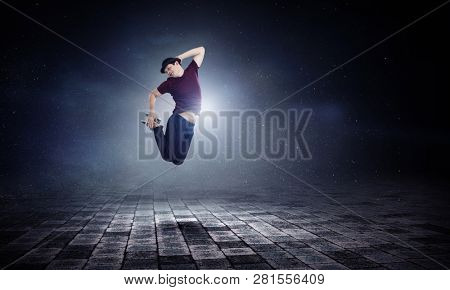 Dance is his world . Mixed media