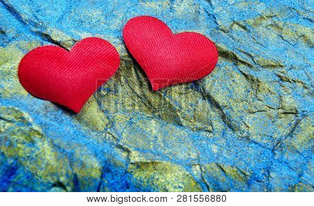 Two Lovers Hearts On A Golden-blue Background.  Postcard. Heart Symbol Of Love.