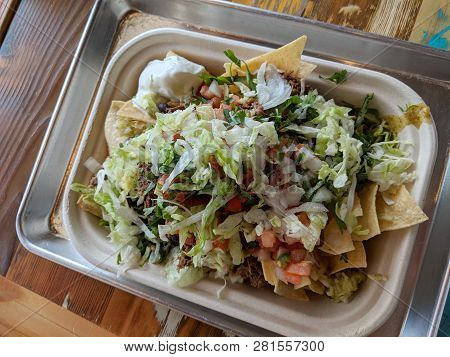 Super Nachos - Homemade Chips Topped With Chile Con Queso Blanco And Braised Beef Slow-cooked And Sh