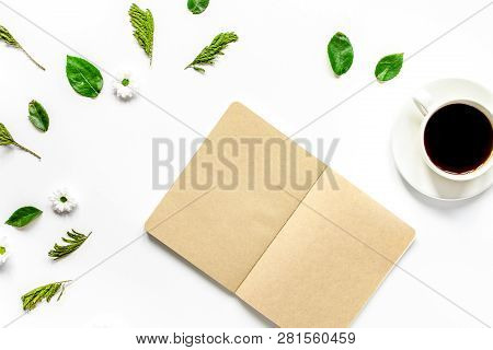 Froral Flat Lay With Cup And Notepaper Top View Mockup