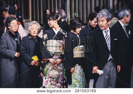 Tokyo, Japan - November 18, 2018: Guests during traditional Japanese wedding ceremony held in the Meiji Jingu (Meiji Shrine). Meiji Shrine is very popular place for Shinto wedding ceremony.