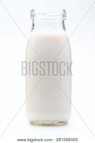 Milk In Glass Bottle. Without Lid. Isolated On White Background.