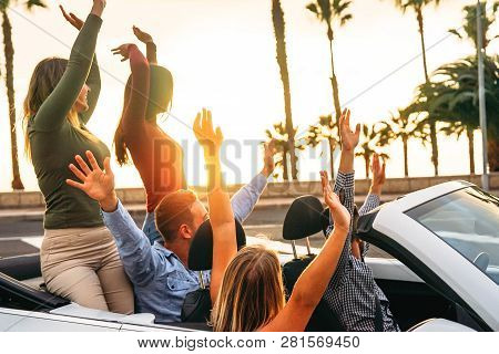 Happy Friends Having Fun In Convertible Car In Vacation - Young People Enjoying Time Traveling And D