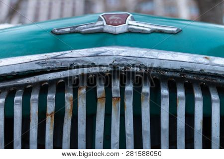Old Soviet Car Volga. Turquoise Retro Car Covered With Snow. Gaz-21 On The Street In Winter.