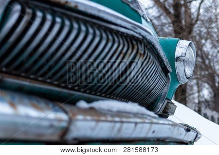 Old Soviet Car Volga. Turquoise Retro Car Covered With Snow. Gaz-21 On The Street In Winter.