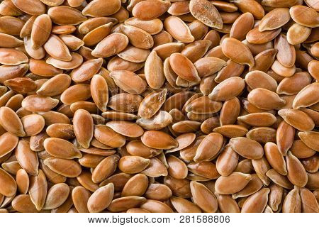 Close Up Of Brown Flax Seeds Background, Top View, Studio Shot