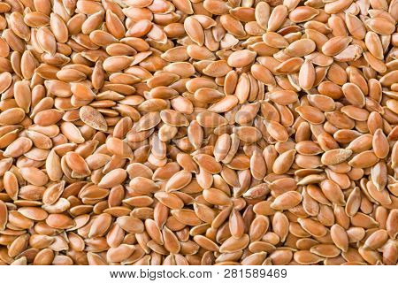 Close Up Of Brown Flax Seeds Background, Top View, Studio Shot