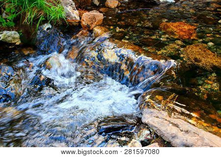 Water Stream In Motion Blur Mountain River In Nature Park Ergaki, Russia, Siberia. Natural Spring Wi
