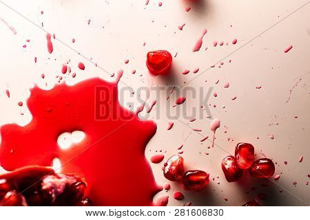 Closeup View Of Grain Red Grenades. Juicy Ripe Red Granets Or Garnets. Fruits Of Red Ripe Pomegranat