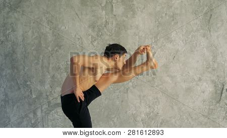 Sportsman Doing Sport Exercise, Bending In Variation Of Utthita