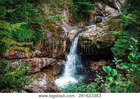 Mountain Cascade Waterfall. Eastern Abkhazia. Near The Town Of Tkvarcheli. Akarmara District.