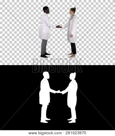 Successful Team Of Surgeons Giving High Five And Laughing Isolated On White Background, Alpha Channe