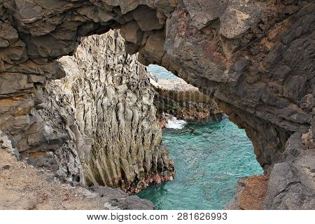 Costa Del Silencio - High Volcanic Rock Formation In The Silence Bay With Clear Turquoise Water
