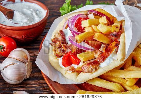 Close-up Of Greek Souvlaki, Pita Ma Gyros With Chicken Meat, Vegetables, French Fries And Yogurt Gar
