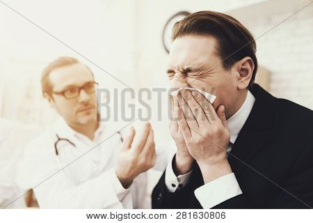Otolaryngologist Prescription Out Drops For Nose To Man With Genyantritis. Confident Businessman At 