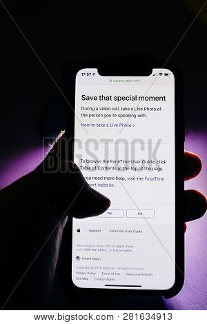 Paris, France - Jan 30, 2018: Man Holding Apple Iphone Xs With Facetime App Reading Support Webpage 