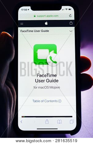 Paris, France - Jan 30, 2018: Man Holding Apple Iphone Xs With Facetime Icon And User Guide On The S