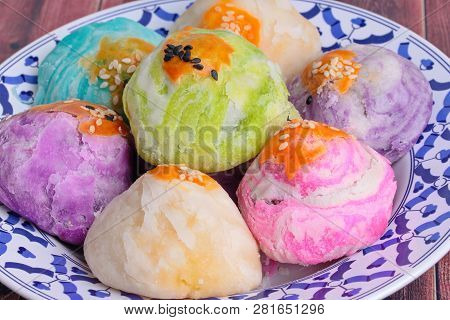 Colorful Chinese Pastry Moon Cake On Thai Style Plate .