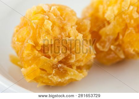 Colombian Traditional Papaya Sweet Called Caballito In A White Ceramic Dish