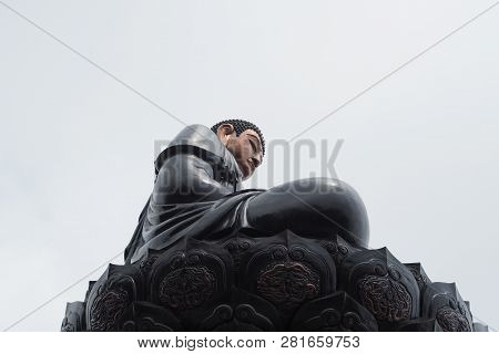 Side View Of Black Buddha Statue At Fansipan Mountain In Vietnam.