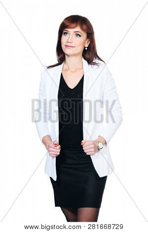 A portrait of a beautiful woman wearing classic clothes and posing over the white background in the studio. Beauty, fashion, business.