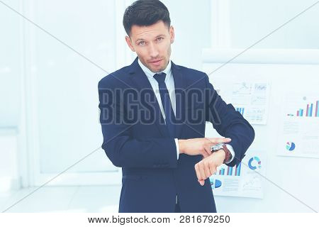 Concept - Take Care Of Your Time. Businessman Points To His Watc