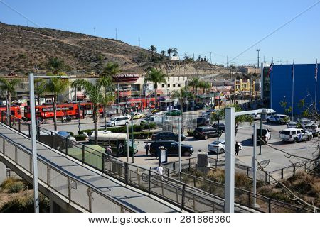 SAN YSIDRO, CALIFORNIA - N0V 26, 2018: Port of entry and Red Line Trolleys at the USA Mexico border in San Ysidro, California.