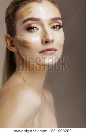 Laughing Woomen Applying Moisturizing Cream On Her Face. Photo Of Young Girl With Flawless Skin On B