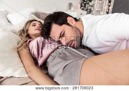 Pretty Blond Long-haired Woman In Beautiful Home Clothes Smiling Nicely