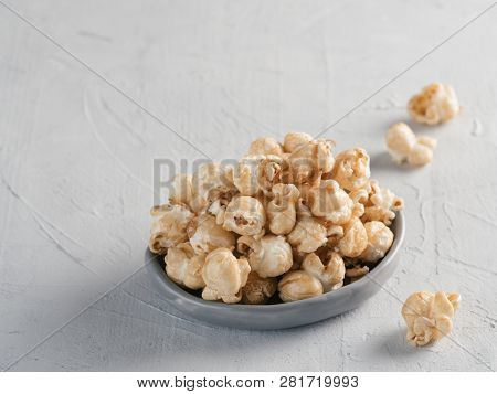 Popcorn In Gray Craft Trendy Plate On Gray Concrete Background. Moovie Background With Copy Space. T