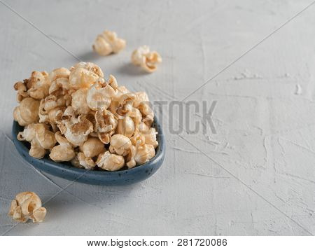 Popcorn In Gray Craft Trendy Plate On Gray Concrete Background. Moovie Background With Copy Space. T