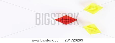 Red Paper Boat Among Other White. Leadership, White Crow, Individuality. Piranhas And A Shark. Not L