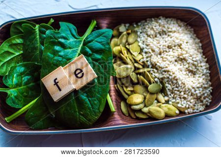 Spinach, Pumpkin Seeds, Sesame On A White Background. Microelement Fe. Close-up.