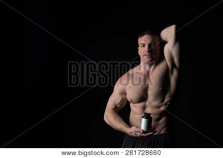 Handsome Macho Man Or Sexy Muscular Guy With Athlete Body And Torso Holds Plastic Jar Or Container W