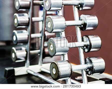 Stand With Dumbbells In Gym With Hign Contrast And Monochrome Color Tone