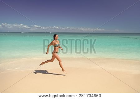 Girl Or Woman In Sexy Bikini Run On Tropical Beach With White Sand, Turquoise Sea Or Ocean Water On 