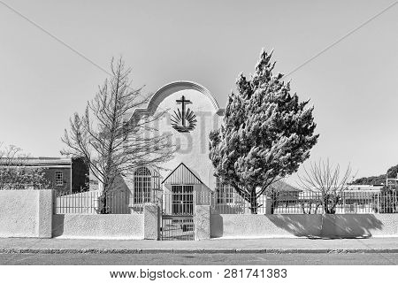 De Aar, South Africa, August 6, 2018: A Monochrome Street Scene, With The Old Apostolic Church, In D